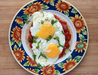 Huevos rancheros in colorful sunflower plate
