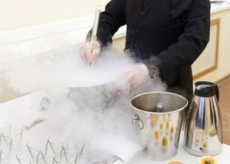 Chef is cooking ice cream with liquid nitrogen