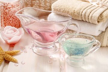 Pink spa set: liquid soap, scented candles, towels and rose sea