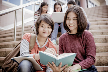 group of happy teen high school students outdoors