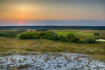 Fototapeta na wymiar Dawn over the steppe field