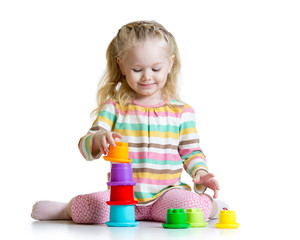 little girl playing with color toys