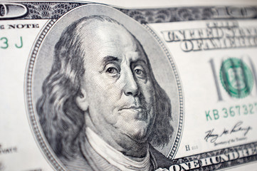The close-up of Benjamin Franklin's face on the 100 dollar bill
