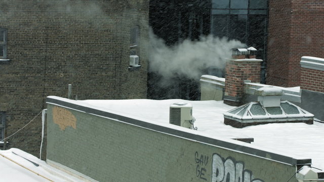 chimney blowing smoke in the winter