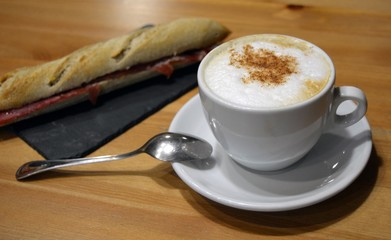Prosciutto sandwich with cup of cappuccino
