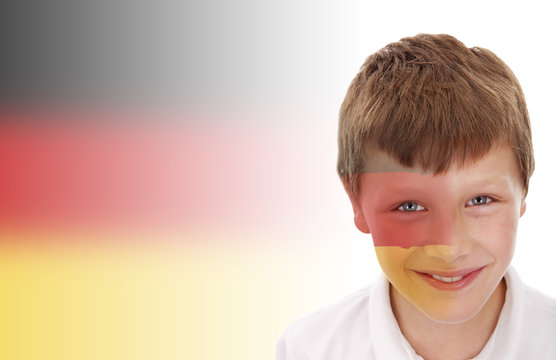 Young boy with Germany flag painted on his face