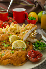 Schnitzel, french fries and microgreens salad