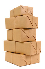 Tall stack or pile of several various brown paper package or parcel for delivery isolated on white background photo vertical