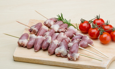 Raw chicken hearts for barbecue
