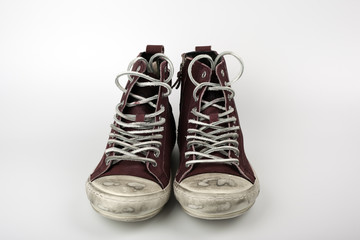 Red leather sneakers on a white background