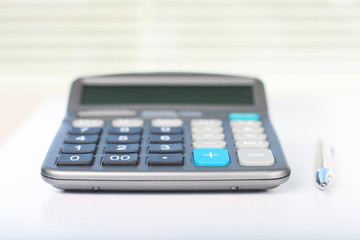 Calculator on a white table