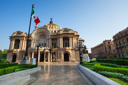 Palace of fine arts facade and Mexican flag