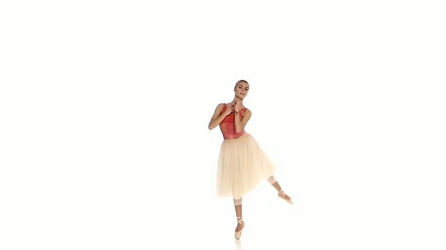 Young girl dances sensual ballet, on white background, slow