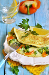 Omelet stuffed with broccoli,cheese and sweet pepper.