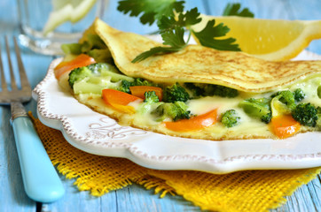 Omelet stuffed with broccoli,cheese and sweet pepper.