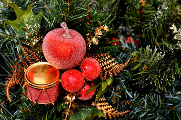 Red Christmas ornament hanging on a Christmas tree