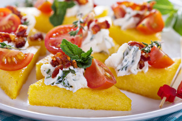 Polenta appetizers with ricotta and bacon