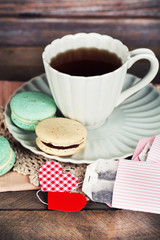 Heart shaped teabag tags, macaroons and cup of tea