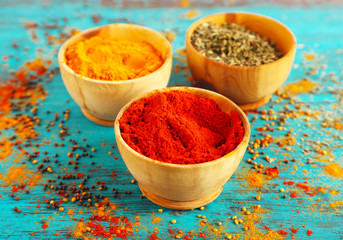 Different seasoning in wooden bowls