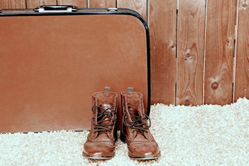 Retro suitcase with male shoes