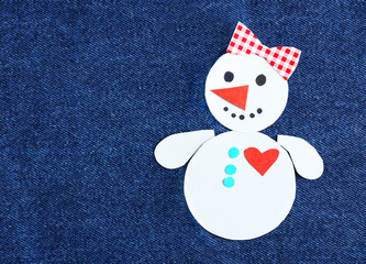 Handmade snowman on bright background