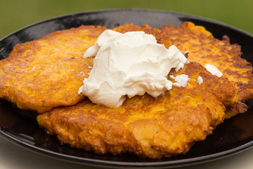 Potato pancakes with sour cream