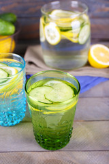 Fresh water with lemon and cucumber in glassware