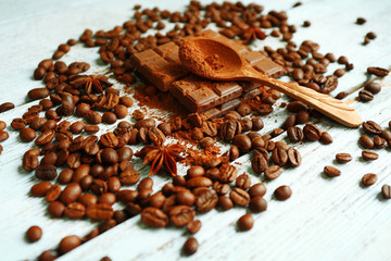 Still life with chocolate, grains and spice on wooden