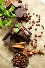 Still life with set of chocolate on burlap cloth, closeup