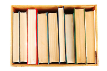 Books in wooden box, top view
