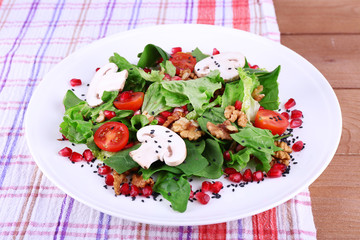 Fresh salad with greens, garnet and spices