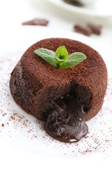 Hot chocolate pudding with fondant centre on plate, close-up
