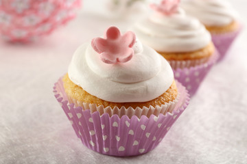 Delicious cupcakes on table close-up