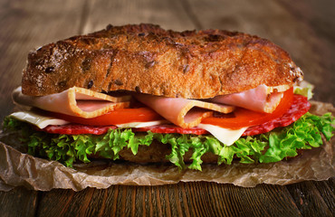 Fresh and tasty sandwich with ham and vegetables
