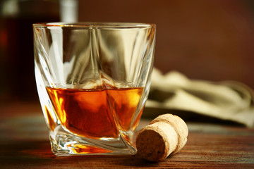 Whiskey on wooden background