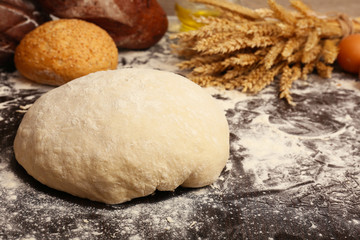 Making bread on table on wooden background
