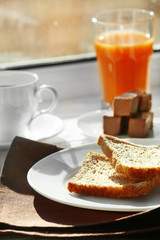 Delicious breakfast on windowsill background