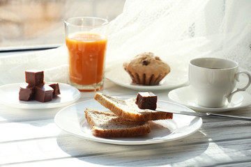 Delicious breakfast on windowsill background