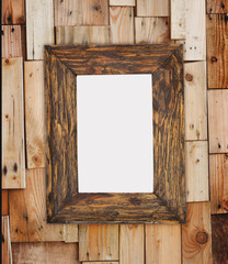 Old picture frame on  stacked wood wall.