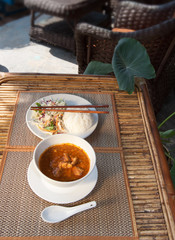 Khmer A-mok with rice and vegetable salad