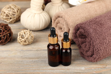Beautiful spa composition with aromatic oil and massage bags