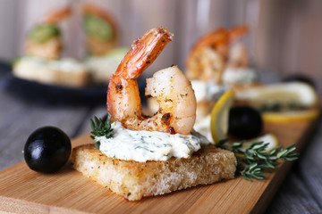 Appetizer canape with shrimp and olives