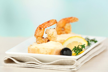 Appetizer canape with shrimp and olives