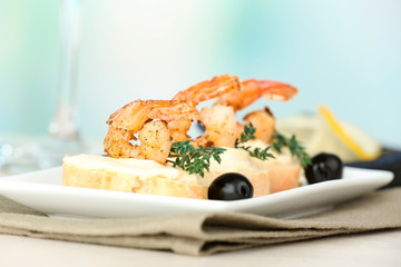 Appetizer canape with shrimp and olives
