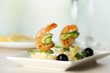 Appetizer canape with shrimp and olives