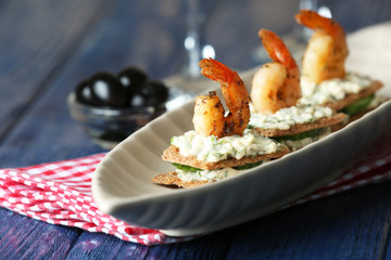 Appetizer canape with shrimp and cucumber