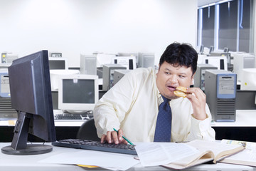 Scared worker using computer in office