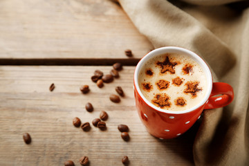 Cup of coffee  and macaroons on old wooden table