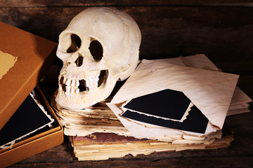 Still life with human skull and retro book
