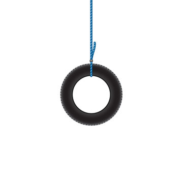 Car tire hanging on blue rope